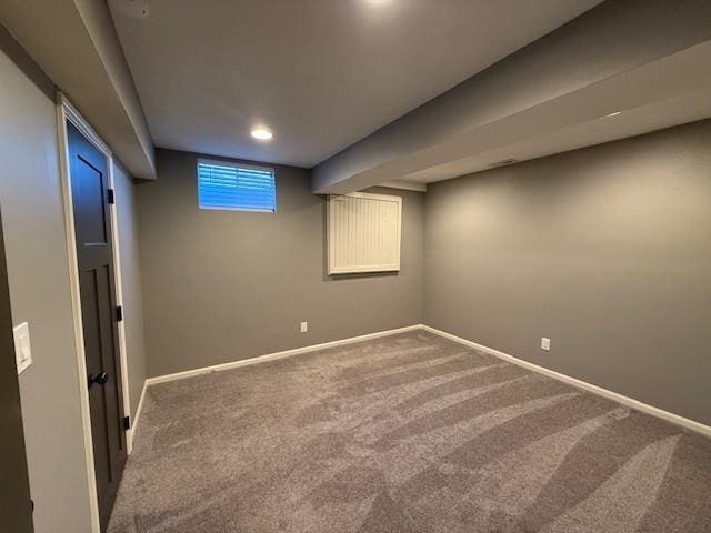 basement with baseboards and carpet floors