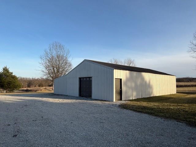 view of pole building with driveway