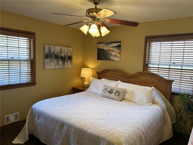 bedroom with visible vents and a ceiling fan