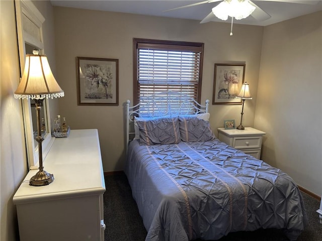 carpeted bedroom with baseboards and a ceiling fan