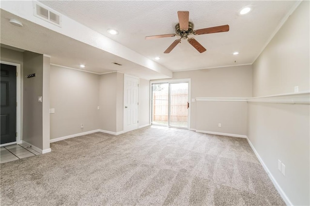 carpeted spare room featuring recessed lighting, visible vents, and baseboards