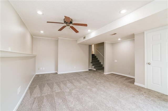 finished basement with visible vents, recessed lighting, carpet floors, baseboards, and stairs