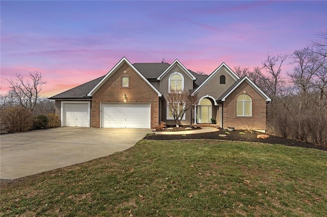 16520 NW 178th St, Platte City, MO 64079 - traditional-style home featuring concrete driveway, brick siding, a front lawn, and a garage