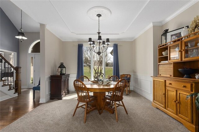 16520 NW 178th St, Platte City, MO 64079 - dining room with a chandelier, light colored carpet, stairs, a raised ceiling, and wainscoting