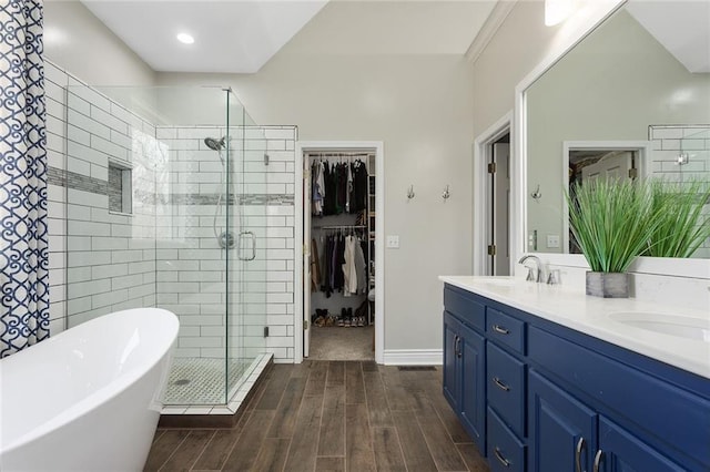 16520 NW 178th St, Platte City, MO 64079 - full bathroom with a shower stall, a soaking tub, double vanity, wood finish floors, and a spacious closet