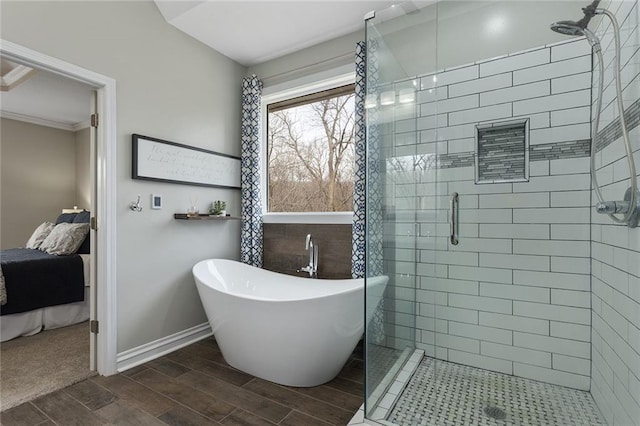 16520 NW 178th St, Platte City, MO 64079 - full bathroom featuring a shower stall, wood tiled floors, a freestanding bath, and ornamental molding