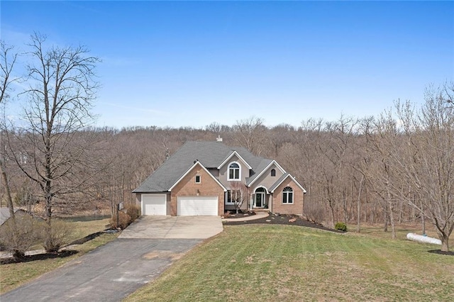 16520 NW 178th St, Platte City, MO 64079 - traditional-style home featuring driveway, a front yard, brick siding, and a garage