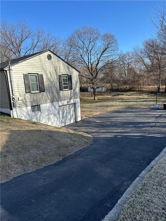 exterior space with a garage and driveway