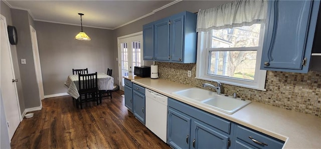 kitchen with blue cabinetry, dark wood-style floors, white dishwasher, and a sink