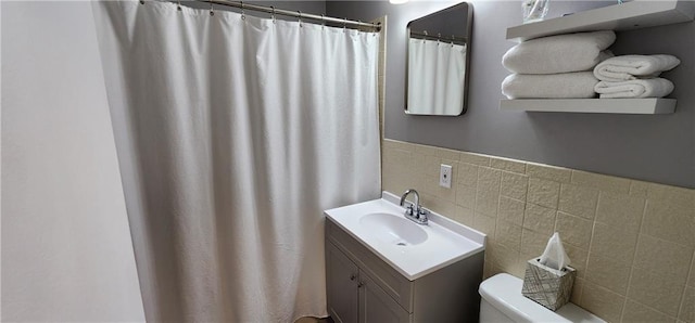 full bath with vanity, tile walls, toilet, and a shower with shower curtain