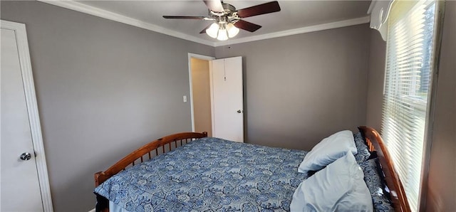 bedroom featuring ornamental molding and a ceiling fan