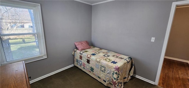 bedroom with baseboards and ornamental molding