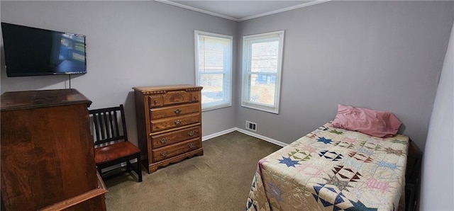 carpeted bedroom with visible vents, crown molding, and baseboards