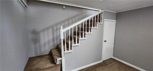 stairway featuring baseboards and carpet