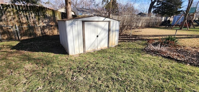 view of shed with a fenced backyard