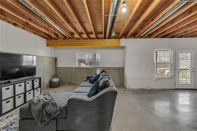 living room featuring concrete flooring