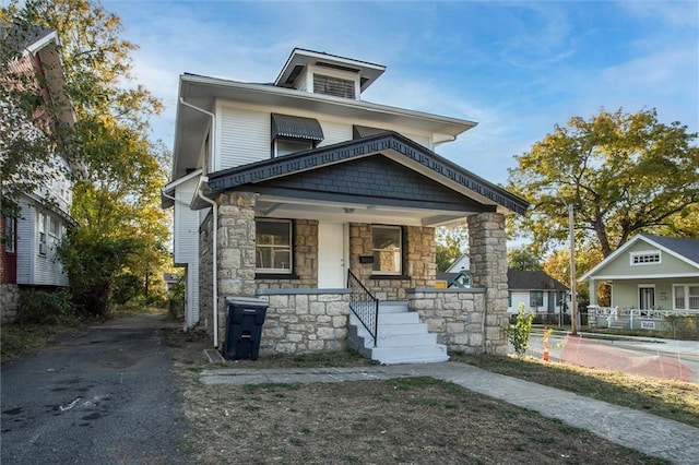 traditional style home with covered porch