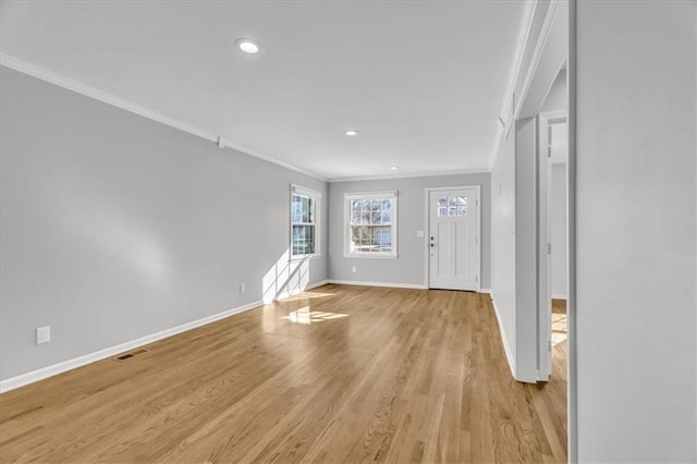 foyer with visible vents, ornamental molding, recessed lighting, light wood-style floors, and baseboards