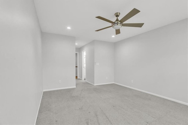 carpeted empty room with recessed lighting, baseboards, and ceiling fan