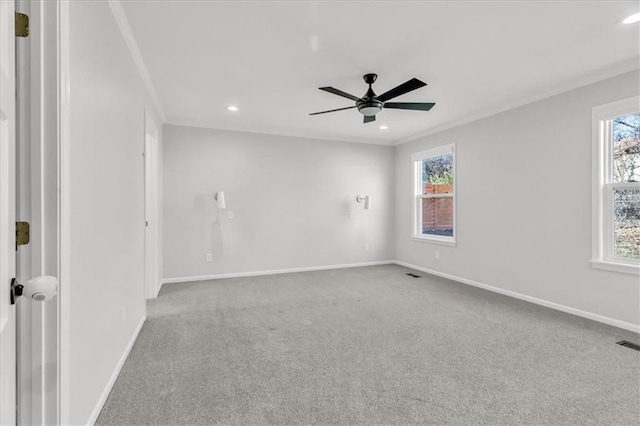 empty room with baseboards, carpet floors, and ceiling fan