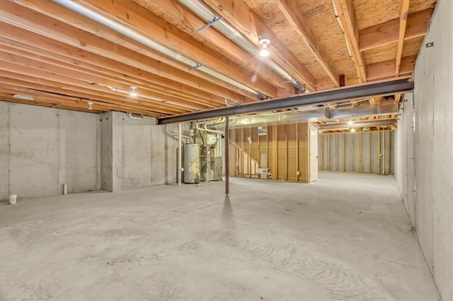 unfinished basement with gas water heater