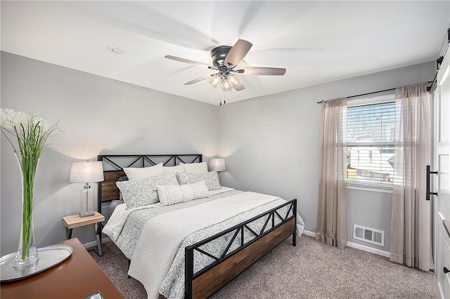 bedroom with visible vents, ceiling fan, baseboards, and carpet