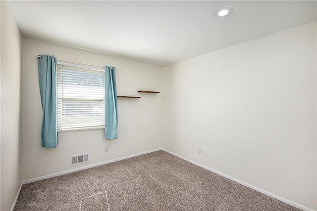 unfurnished room featuring recessed lighting, carpet flooring, baseboards, and visible vents