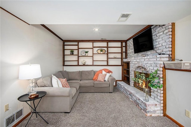 carpeted living room featuring ornamental molding, a fireplace, visible vents, and baseboards