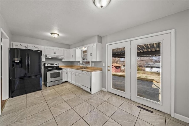 kitchen featuring black refrigerator with ice dispenser, stainless steel electric stove, white dishwasher, white cabinets, and a sink