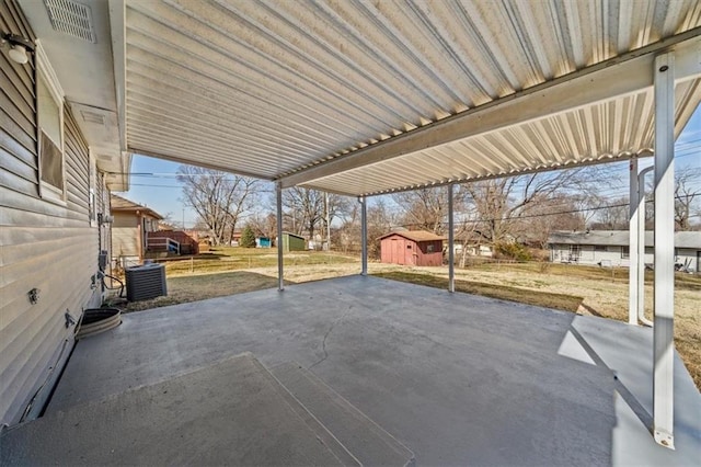 view of patio / terrace featuring cooling unit and an outdoor structure