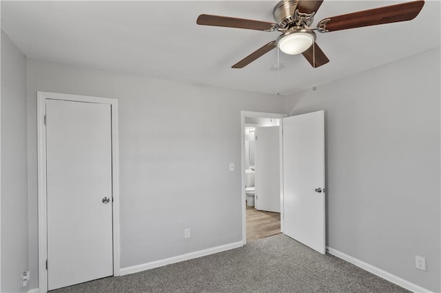 unfurnished bedroom featuring carpet flooring, a ceiling fan, and baseboards