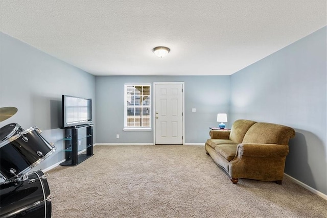 interior space featuring baseboards and a textured ceiling