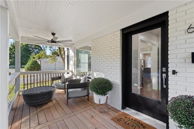 wooden deck with ceiling fan