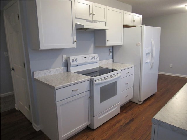 kitchen featuring under cabinet range hood, light countertops, white appliances, white cabinetry, and dark wood-style flooring