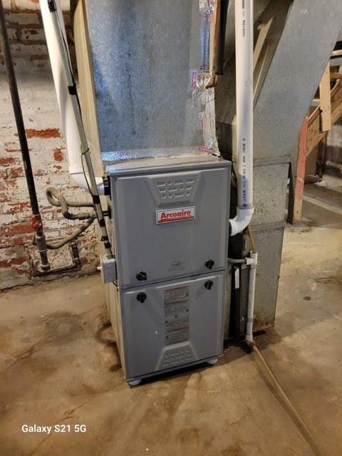 1727 S Crescent Ave, Independence, MO 64052 - utility room featuring heating unit