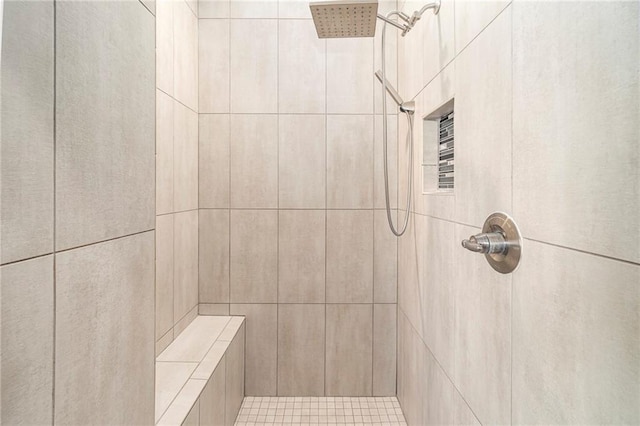 full bath featuring a tile shower