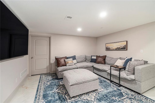 living area with visible vents, baseboards, and marble finish floor