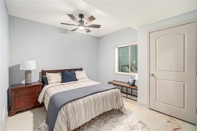 bedroom featuring light carpet and a ceiling fan