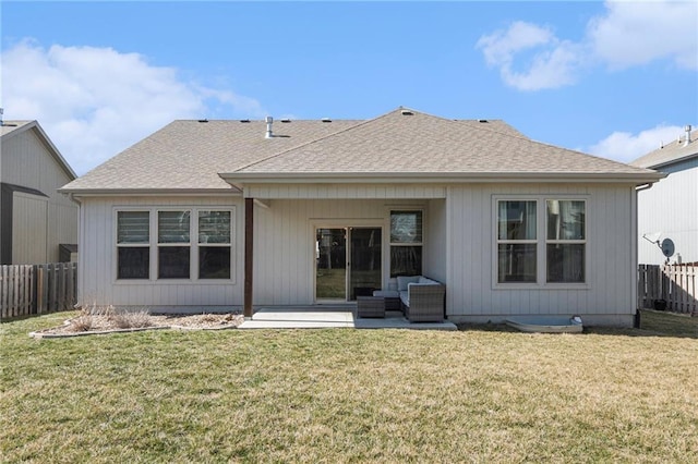 back of house featuring a lawn, a patio, and fence