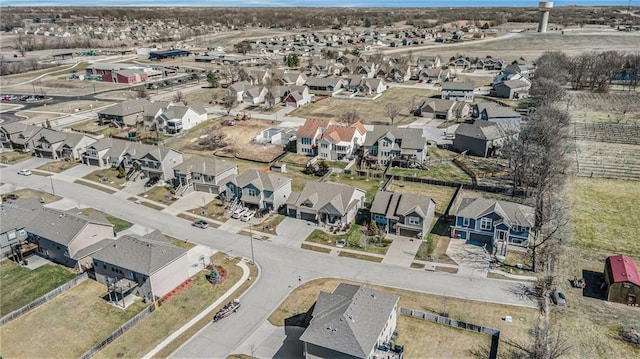 birds eye view of property with a residential view