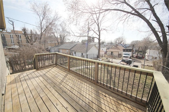 wooden terrace featuring a residential view