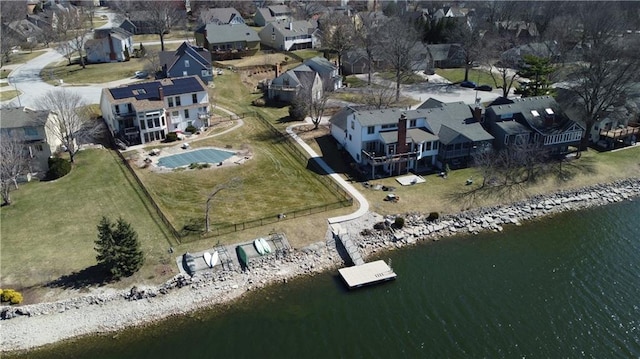 birds eye view of property with a residential view and a water view