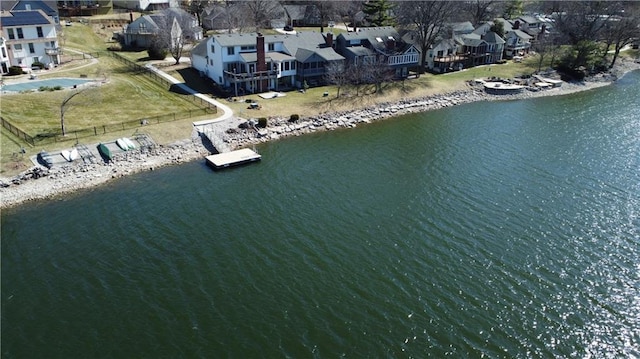 birds eye view of property with a residential view and a water view