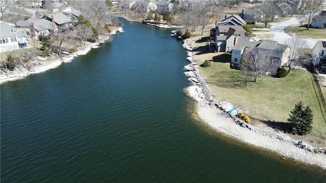 bird's eye view featuring a residential view and a water view