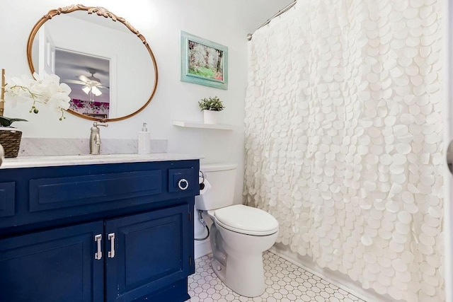 full bathroom with vanity, a shower with shower curtain, and toilet