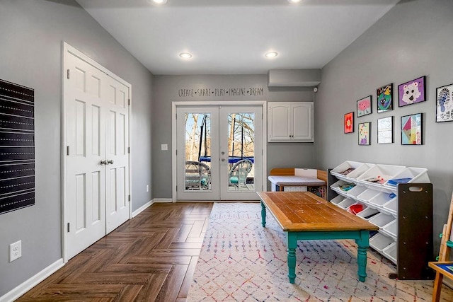 interior space featuring recessed lighting, french doors, and baseboards