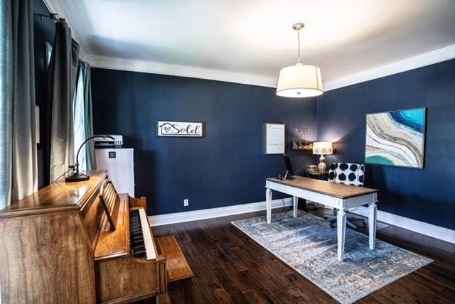 office featuring baseboards, ornamental molding, and wood finished floors