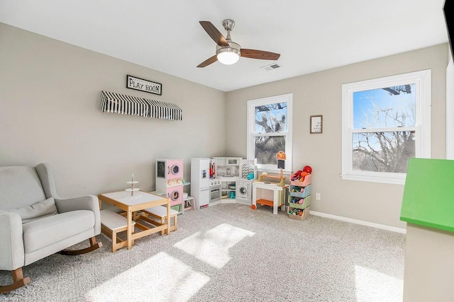 game room featuring baseboards, a ceiling fan, carpet flooring, and visible vents