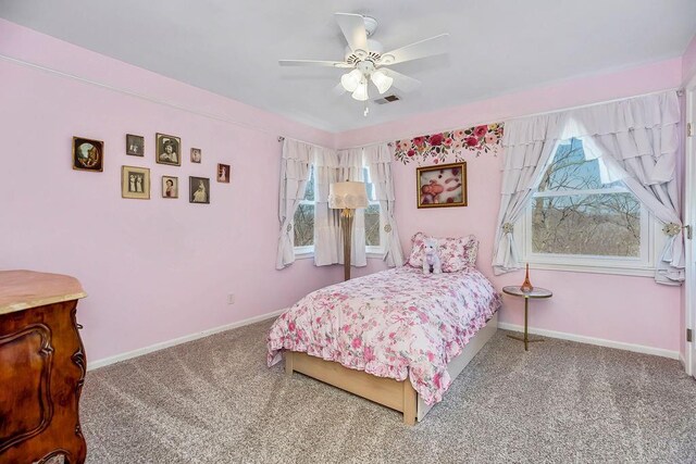 bedroom with carpet flooring, a ceiling fan, baseboards, and visible vents