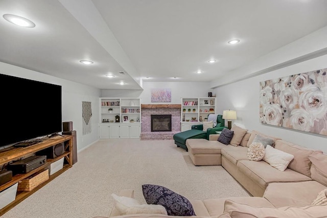 living area with recessed lighting, baseboards, a brick fireplace, and light carpet